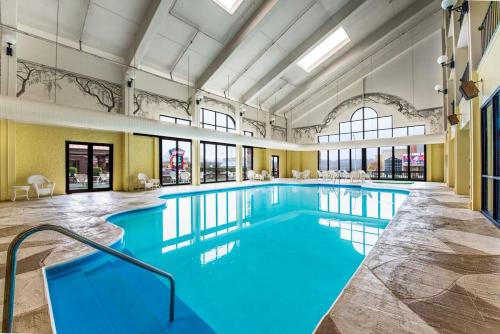 a large pool with blue water in a building at Lodge of the Ozarks in Branson