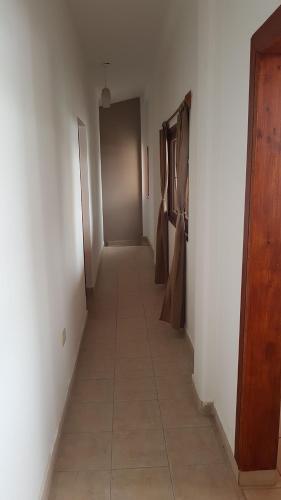an empty hallway with a hallwayngthngthngthngthngthngthngthngthngthngth at Accueillant Auberge Salta in Salta