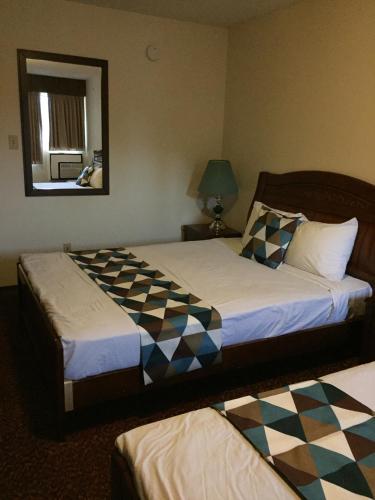 Postel nebo postele na pokoji v ubytování Spring Villa Hotel