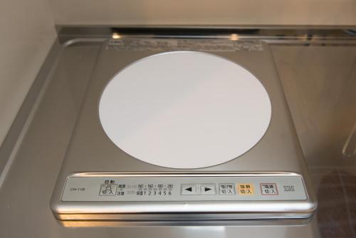 a remote control in a box with a white light at ETAVIA Yufuinekimae in Yufuin