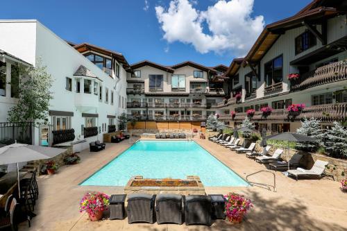 a pool in the courtyard of a hotel at Lodge at Vail, A RockResort in Vail