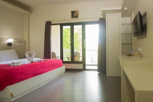 Cama o camas de una habitación en Maxi Hotel Kedonganan