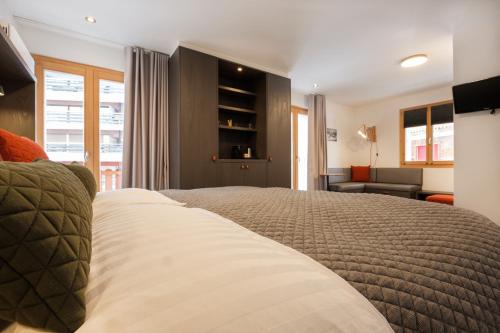 Tempat tidur dalam kamar di Hotel Les Etagnes