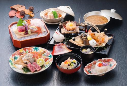 a group of plates of food on a table at Hotel Granvia Osaka-JR Hotel Group in Osaka
