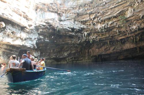 a group of people in a boat in the water at stunning tranquil villa with private pool in Sami