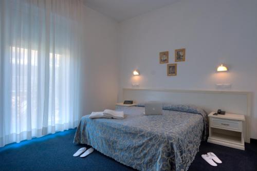 Llit o llits en una habitació de Residence Divina