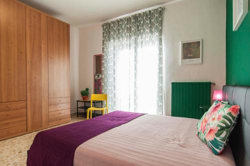 a bedroom with a large bed and a window at Casa Cariddi in Sperlonga