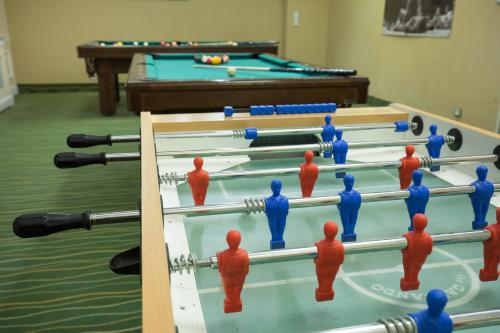 a group of men playing a game of billiard at Hotel Ameliówka in Masłów