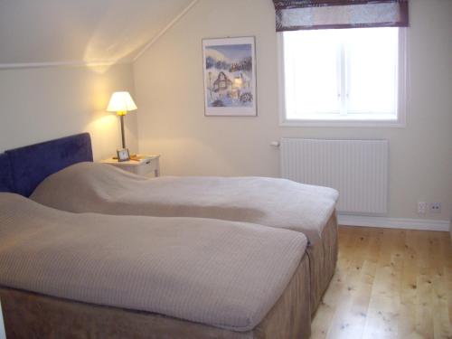 Postel nebo postele na pokoji v ubytování MårtenLiens Gård