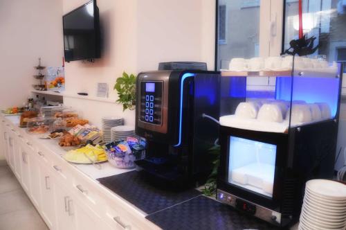a microwave sitting on a counter in a kitchen at Navona Luxury Guesthouse in Rome