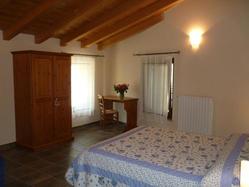 Postel nebo postele na pokoji v ubytování Agriturismo Corte Carolina