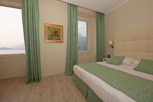 Voodi või voodid majutusasutuse Hotel Du Lac & SPA toas