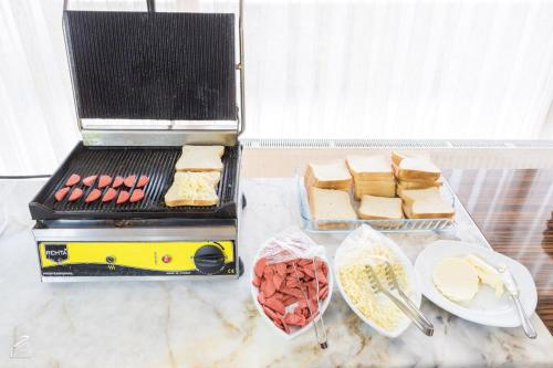 a grill with a bunch of food on a table at Hotel Dosco in Van