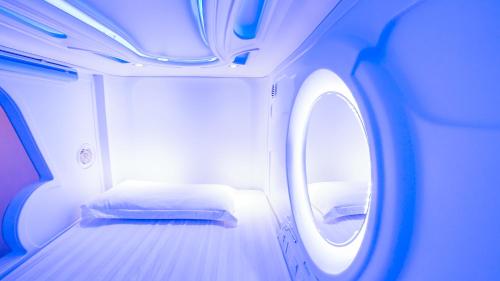 Ένα ή περισσότερα κρεβάτια σε δωμάτιο στο Spacepod@com