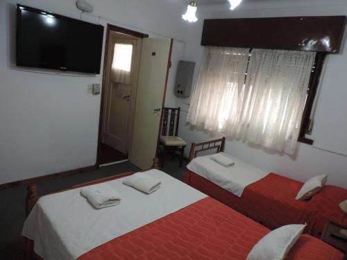 Una cama o camas en una habitación de Hotel Aldea Marina