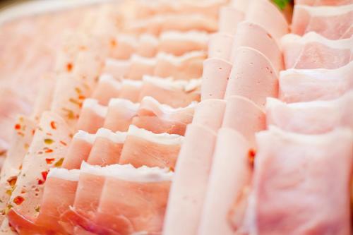 a close up of ham on a rack of meat at Hotel Krone OHG in Gerlingen