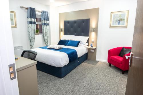 מיטה או מיטות בחדר ב-Abbey Hotel