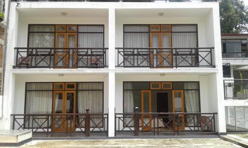 a white building with a bunch of windows at Alta Vista in Ella