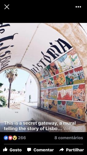 a website with a picture of a mural on a wall at Apartments Alfacinha Ajuda in Lisbon