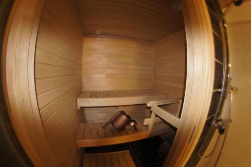 an inside view of a sauna with a jug in it at Sarastus in Tornio