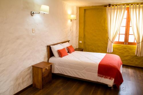 Postel nebo postele na pokoji v ubytování La Casa de Santiago Hotel