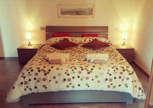 A bed or beds in a room at La Graziosa Dépendance