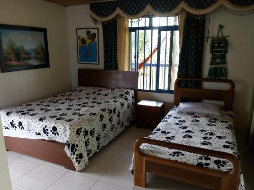 Postel nebo postele na pokoji v ubytování Finca de Mundo