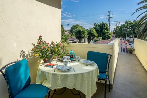 
a table with chairs and a table cloth at Beach House Inn in Santa Barbara
