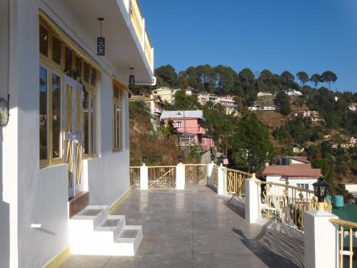 a balcony of a house with a view of a city at Aqua De Vida in Bhowāli