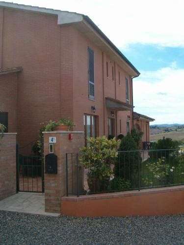 a house with a gate and a fence at B&B La Verbena in Siena