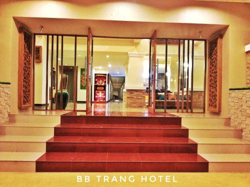 a large lobby with a staircase leading to a hotel at BB Trang Hotel in Trang