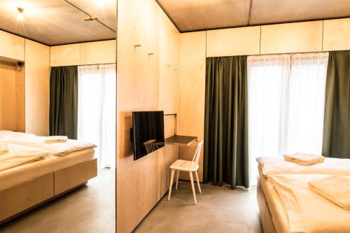 Ένα ή περισσότερα κρεβάτια σε δωμάτιο στο Kitz Boutique Hotel & Restaurant