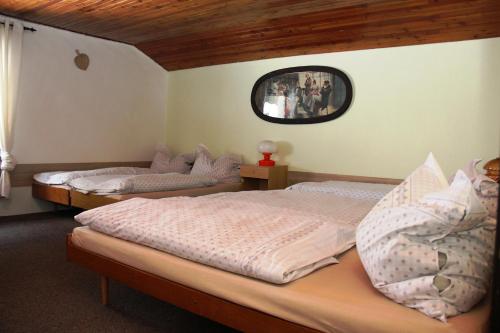Katil atau katil-katil dalam bilik di Penzion Gentiana