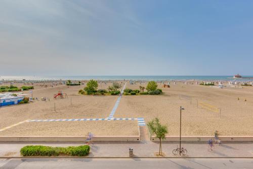 an empty beach with a playground in the sand at Marina Palace Hotel 4 stelle S in Caorle
