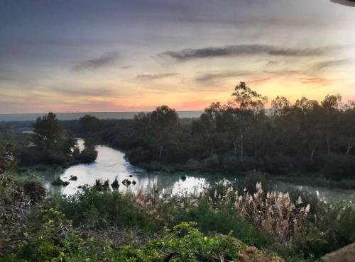 a view of a river at sunset at River Front Estate in Addo