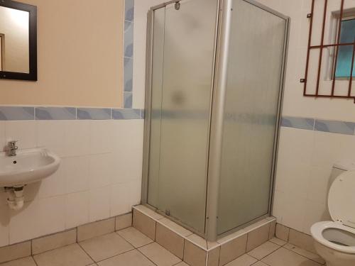 Ein Badezimmer in der Unterkunft Stone Crescent Hotel