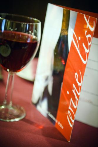 a bottle of wine next to a glass of wine at The Lantern Pike Inn in Hayfield