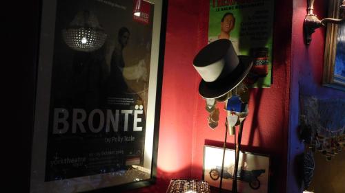 a black and white hat on a lamp in a room at The Old Registry guest house in Haworth