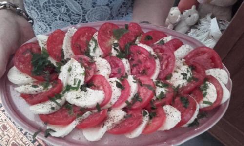 a plate of food with pepperoni and cheese on it at Les Broussous in Sauve