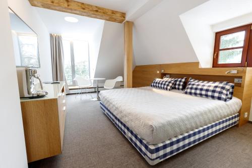 Кровать или кровати в номере Hotel Bedriska Wellness Resort & Spa
