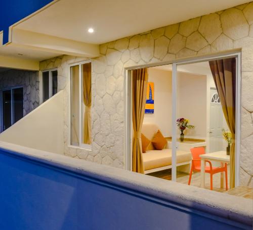 a villa with a pool and a living room at Condo Casa del Arbol in Playa del Carmen