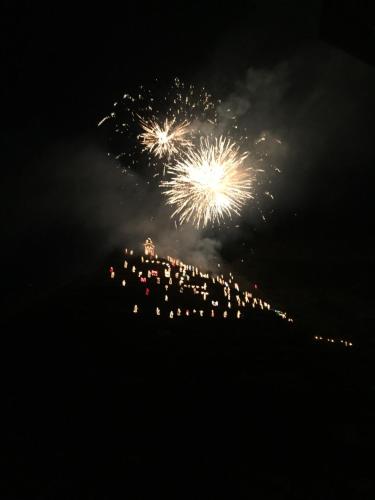 a firework display in the sky at night at Le Storie di Manarola in Manarola