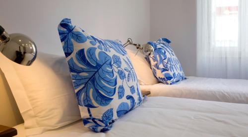 Ένα ή περισσότερα κρεβάτια σε δωμάτιο στο Cacilhas Guest Apartments