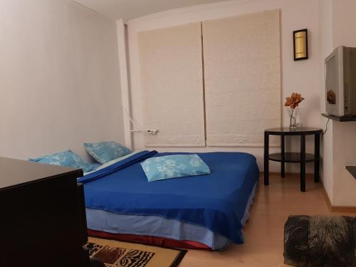 Una cama o camas en una habitación de Libera