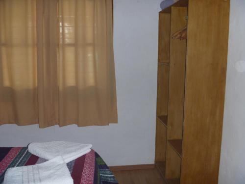 Ένα ή περισσότερα κρεβάτια σε δωμάτιο στο Cabañas Aike