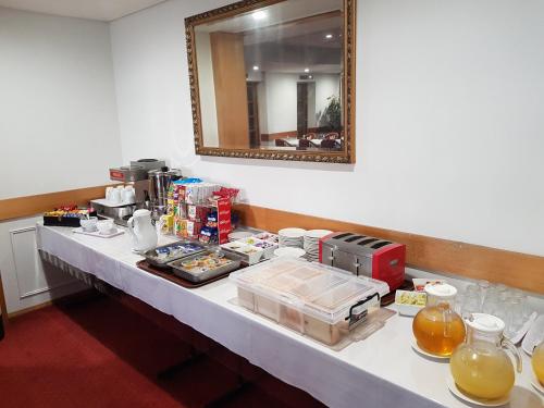 a long table with food and drinks on it at Centrepoint Motor Inn in Rockhampton