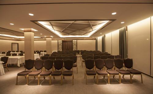 a conference room with chairs and tables in it at Grand Hotel Gaziantep in Gaziantep