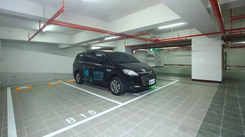 a black car parked in a parking garage at Darlon Hotel in Hsinchu City