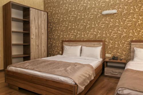 Postel nebo postele na pokoji v ubytování Hotel Gureli