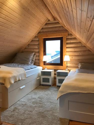 Voodi või voodid majutusasutuse Wellness Hütte am Zwenkauer See bei Leipzig toas